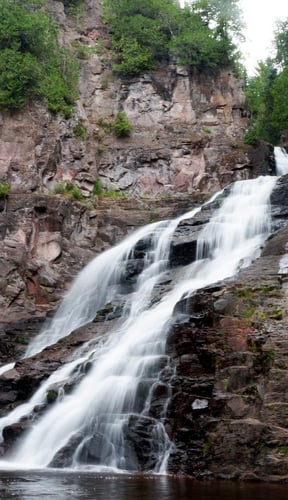 Waterfall cascading over basalt rock on Minnesota's North Shore