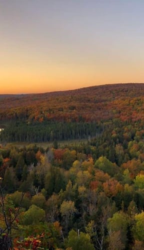 Fall colour panorama over a lake at sunset on the North Shore